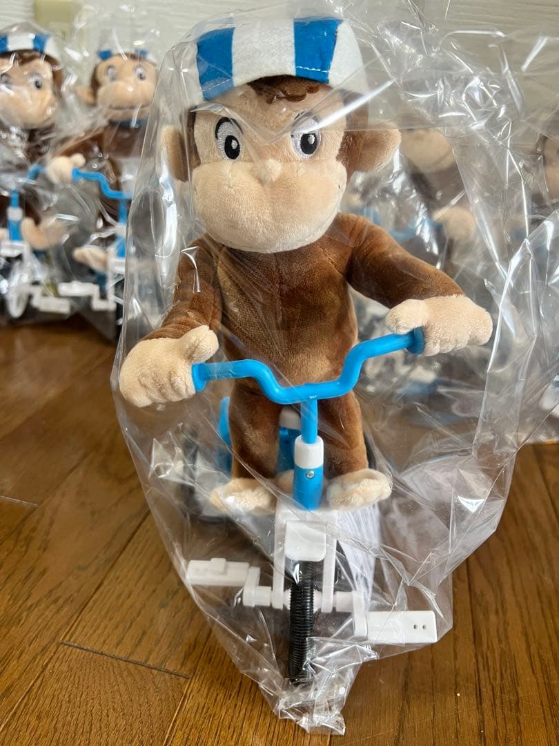 8個★おさるのジョージ 電池で動く三輪車ぬいぐるみ Curious e