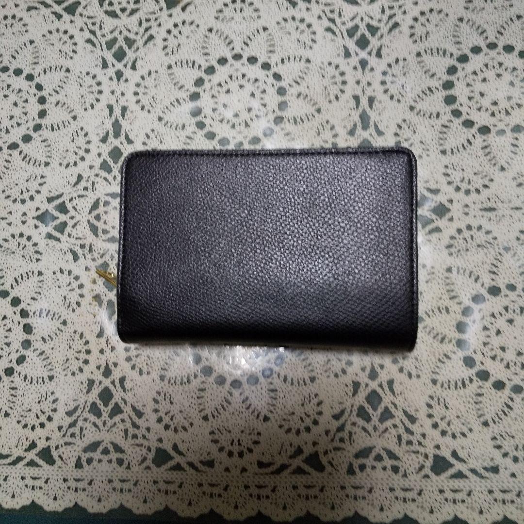 正規品❗️COACHブラックレザー 二つ折り財布 ❣️美品。ゴールドロゴ