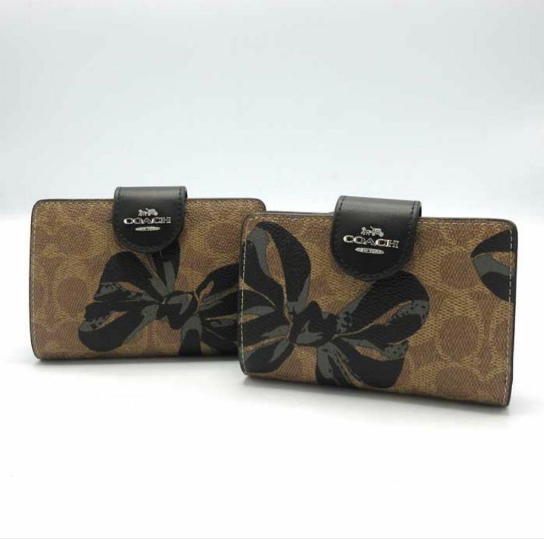 プレゼント 新品未使用 コーチ シグネチャー 二つ折り財布 リボン柄 大人可愛い