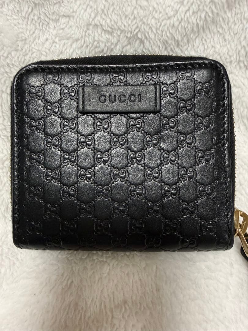 未使用GUCCI 二つ折り財布 ロゴプレート マイクロGG シマレザー 黒