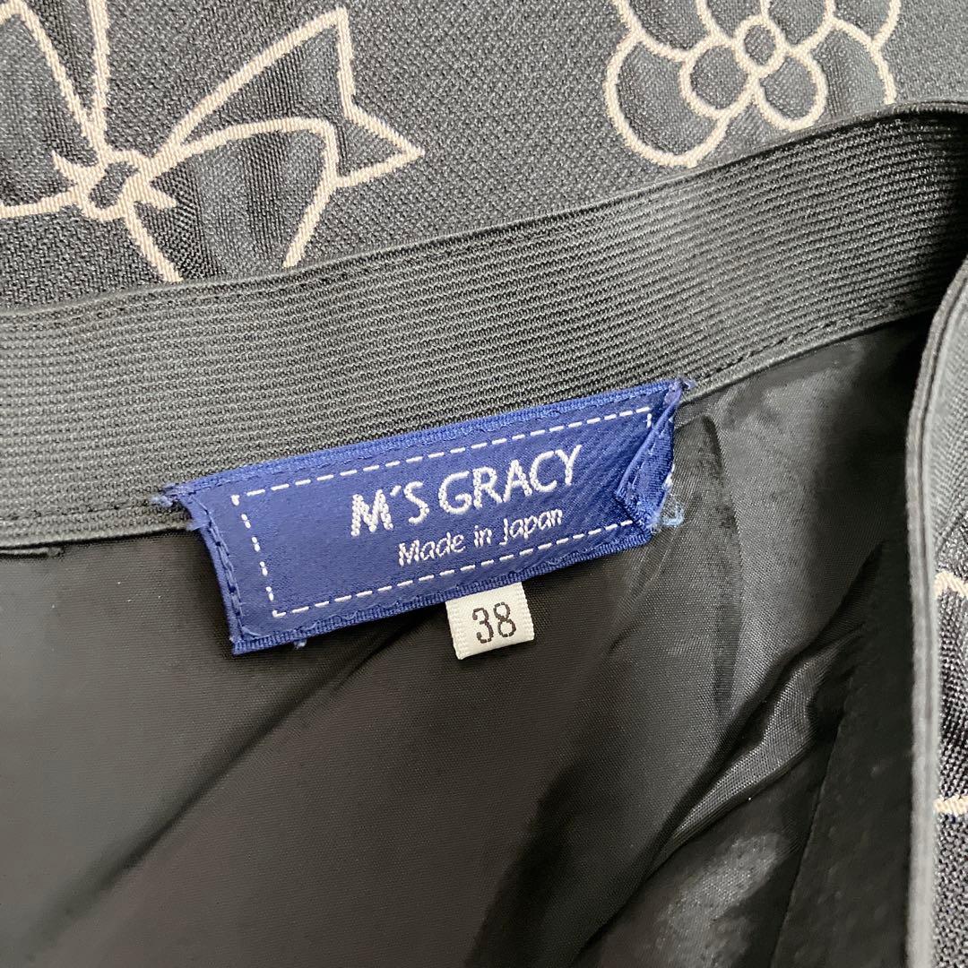 ゆい♪エムズグレイシー　ロゴ　カメリア　チャーム　サーキュラースカート38