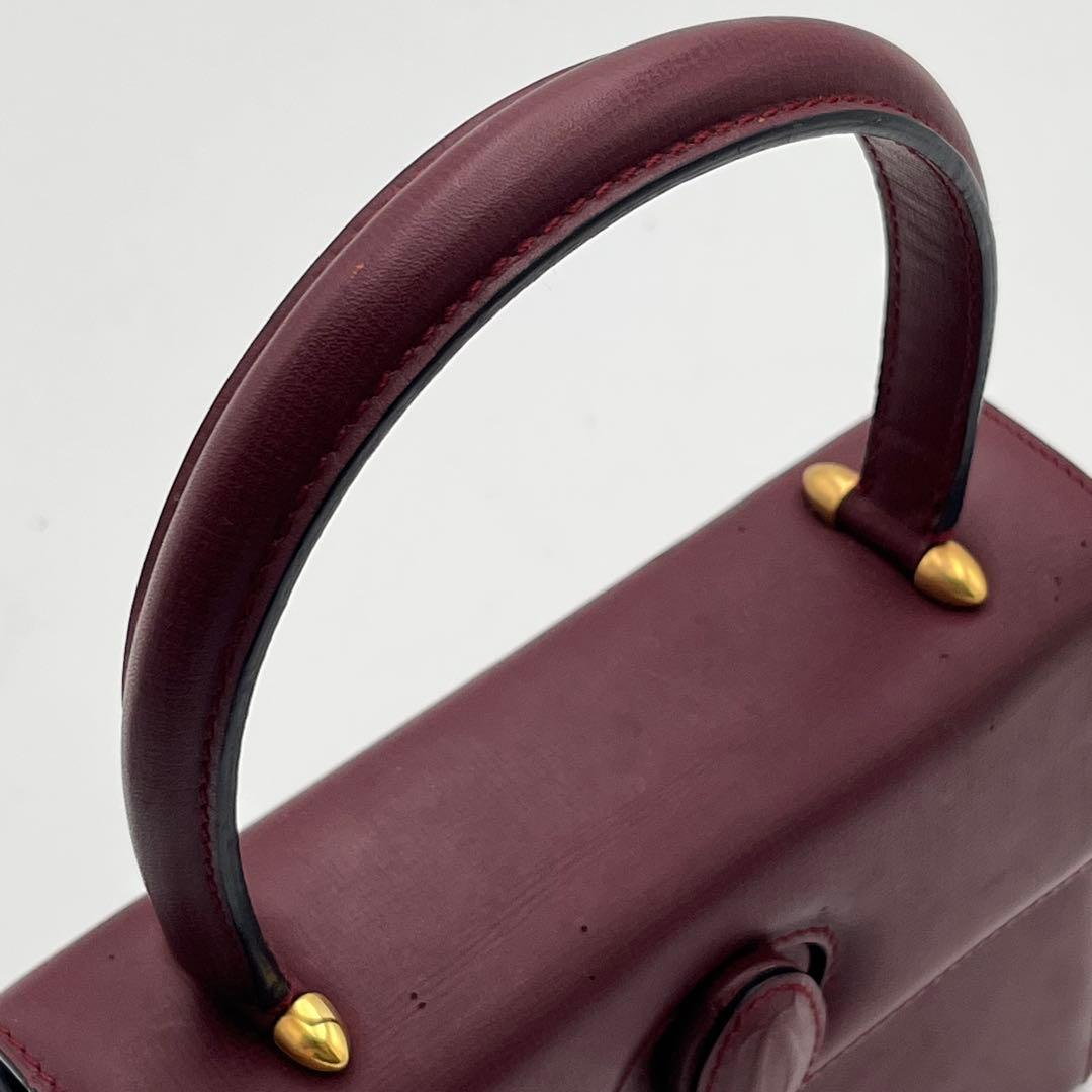 カルテイェ マストライン ターンロック ボックスカーフ ミニハンドバッグ 総柄